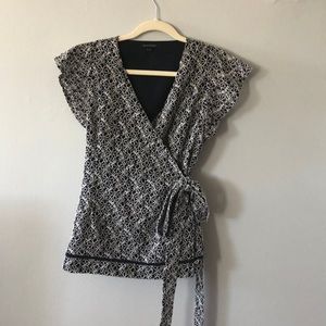 Navy & white wrap blouse w intricate floral design